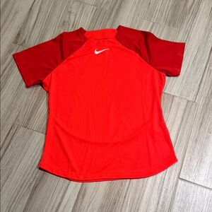 Nike Women's Short Sleeve Dri-FIT Tee in Bright Red and orange